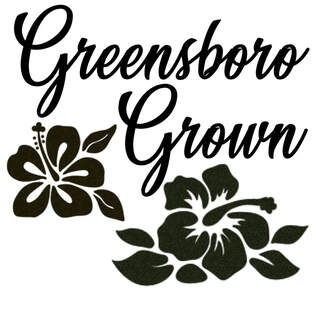 Greensboro grown logo black lettering and lotus images on white background.